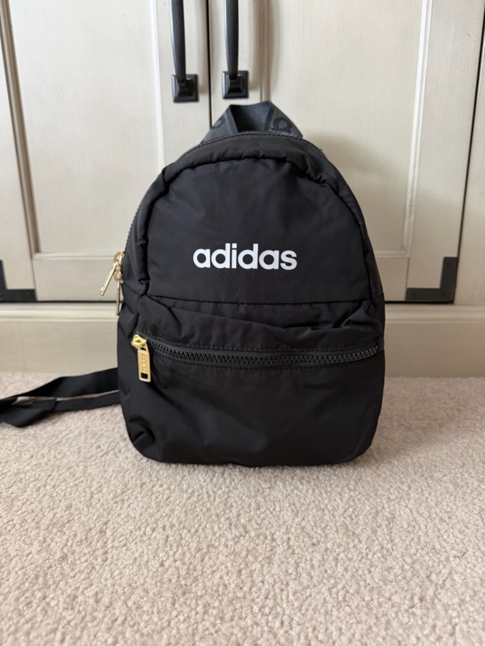 adidas Black Mini Backpack with Gold Zipper Accents